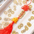 Feng shui Pixiu coin charm with red knot cord, 3 Chinese coins and red tassel, top view